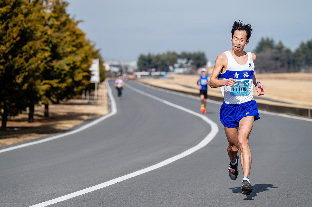 Half-marathon runners competing on a closed road course
